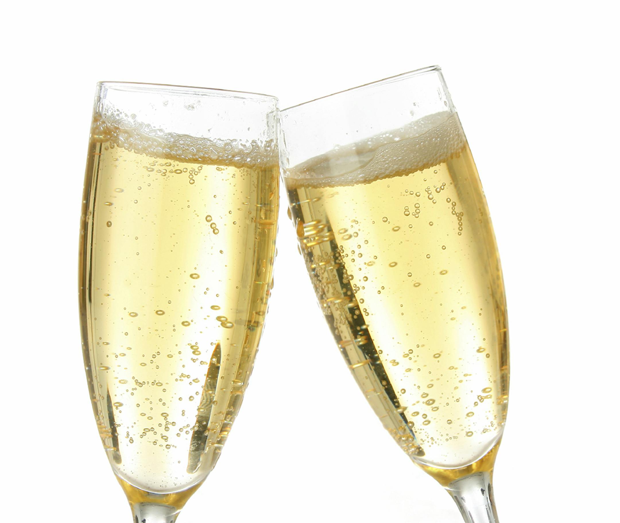 Pair of champagne flutes making a toast.