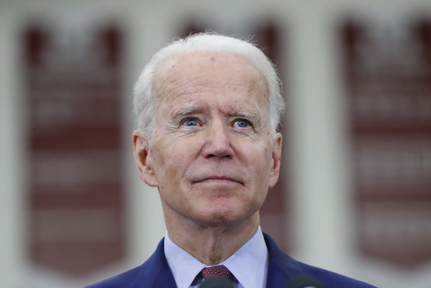 FILE - In this March 9, 2020, file photo Democratic presidential candidate former Vice President Joe Biden speaks during a campaign rally at Renaissance High School in Detroit. Now that he's the presumptive Democratic nominee, Biden is sharpening his tone, still pitching consensus but touting a "bold agenda" aimed at mollifying progressives who remain skeptical he will deliver enough on health care, student loan debts and the climate crisis. (AP Photo/Paul Sancya, File)