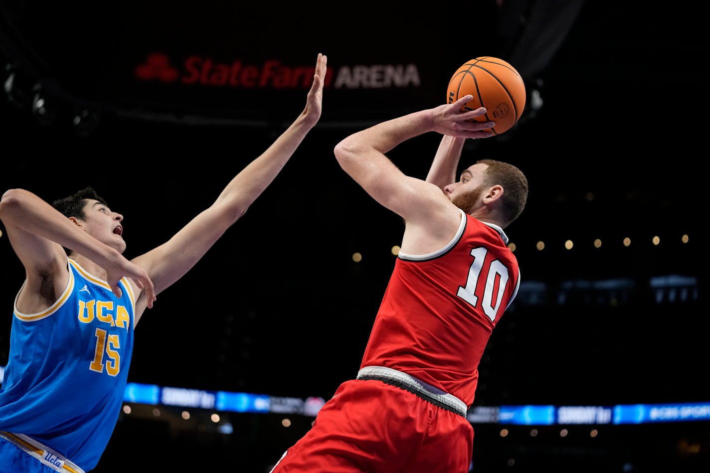 Ohio State forward Jamison Battle (10) shoots the ball against UCLA center Aday Mara (15) during the first half of an NCAA college basketball game Saturday, Dec. 16, 2023, in Atlanta, Ga. (AP Photo/Brynn Anderson)