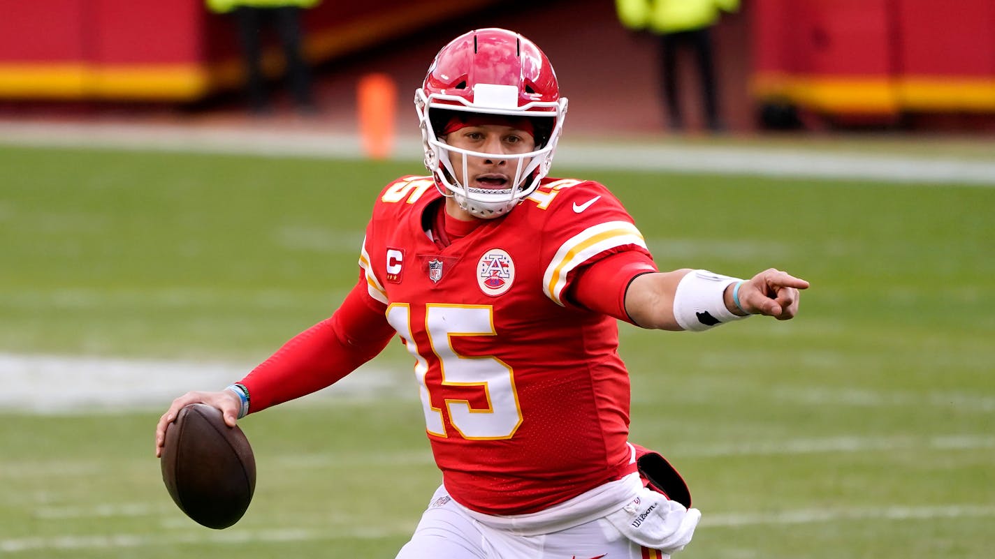 Kansas City Chiefs quarterback Patrick Mahomes looks for a receiver during the second half of an NFL divisional round football game against the Cleveland Browns Sunday, Jan. 17, 2021, in Kansas City, Mo. (AP Photo/Charlie Riedel)