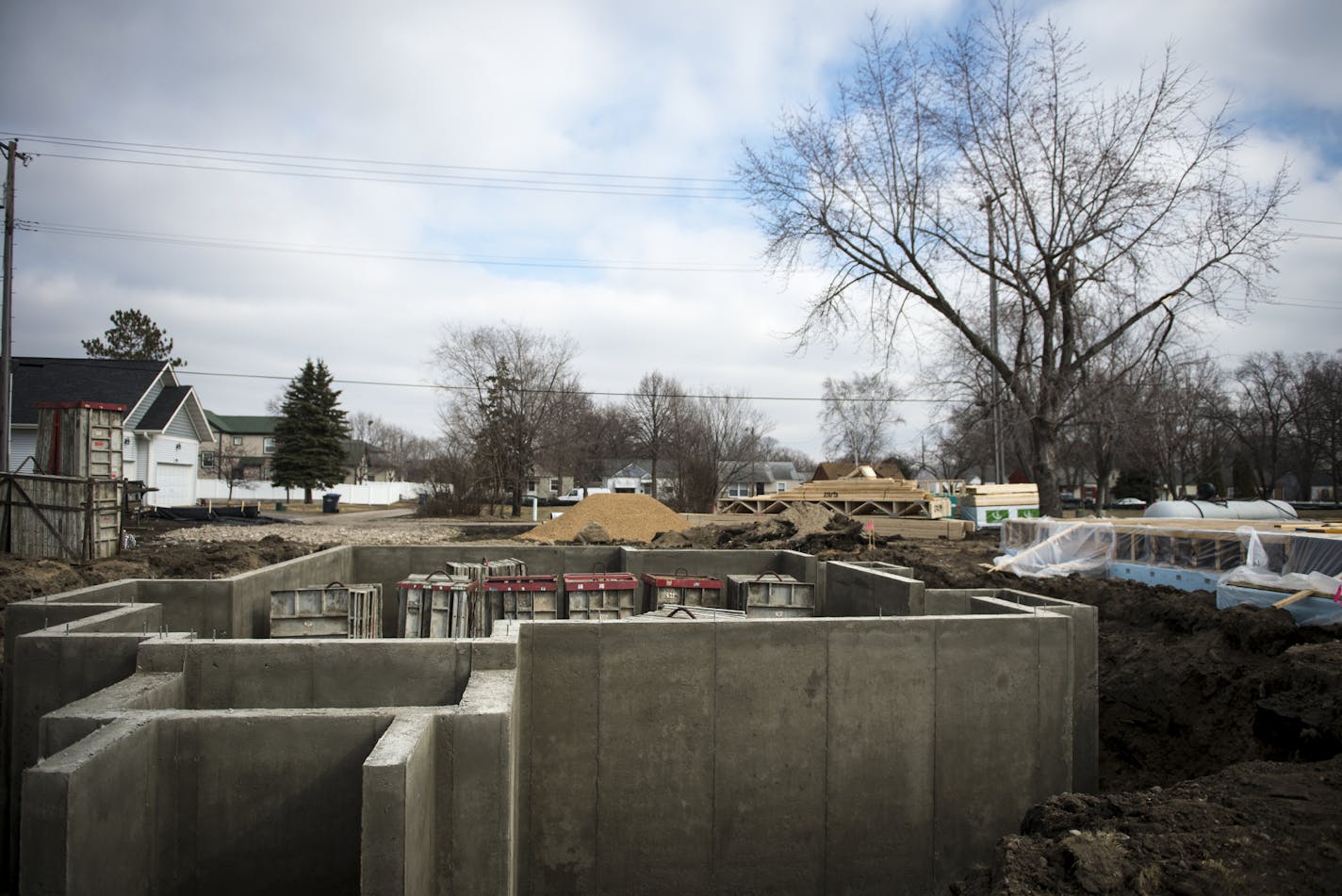 A foundation of a home being built on Humboldt Avenue North. ] (AARON LAVINSKY/STAR TRIBUNE) aaron.lavinsky@startribune.com With hundreds of vacant lots, North Minneapolis should be a home builder's paradise. But an imbalance between what houses cost to build and what buyers are willing to pay has made developing those lots difficult. With house prices on the rise, Bob Lux thinks the time is right for new housing. He's partnering with a neighborhood non-profit to build several dozen houses that