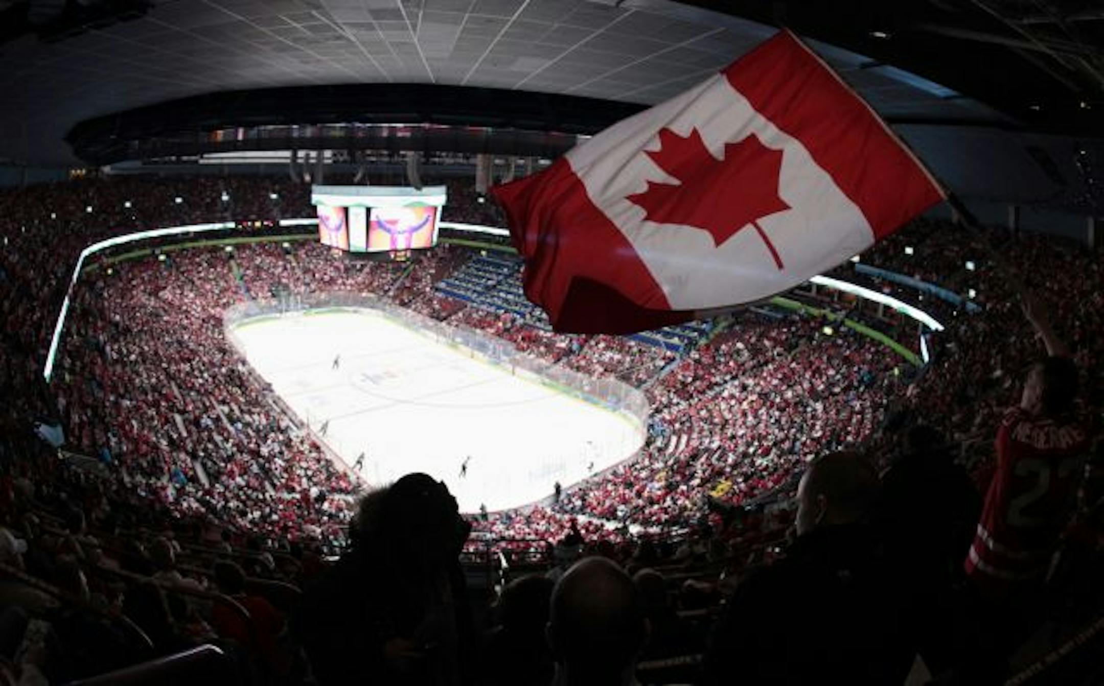 Fans in Vancouver took delight in Canada's 8-0 drubbing of Norway as the teams opened Olympic competition Tuesday.