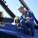 Blue Angels pilot Lt. Cary Rickoff was reflected in the visor of the helmet worn by Star Tribune reporter Pam Louwagie as he went over a few things wi