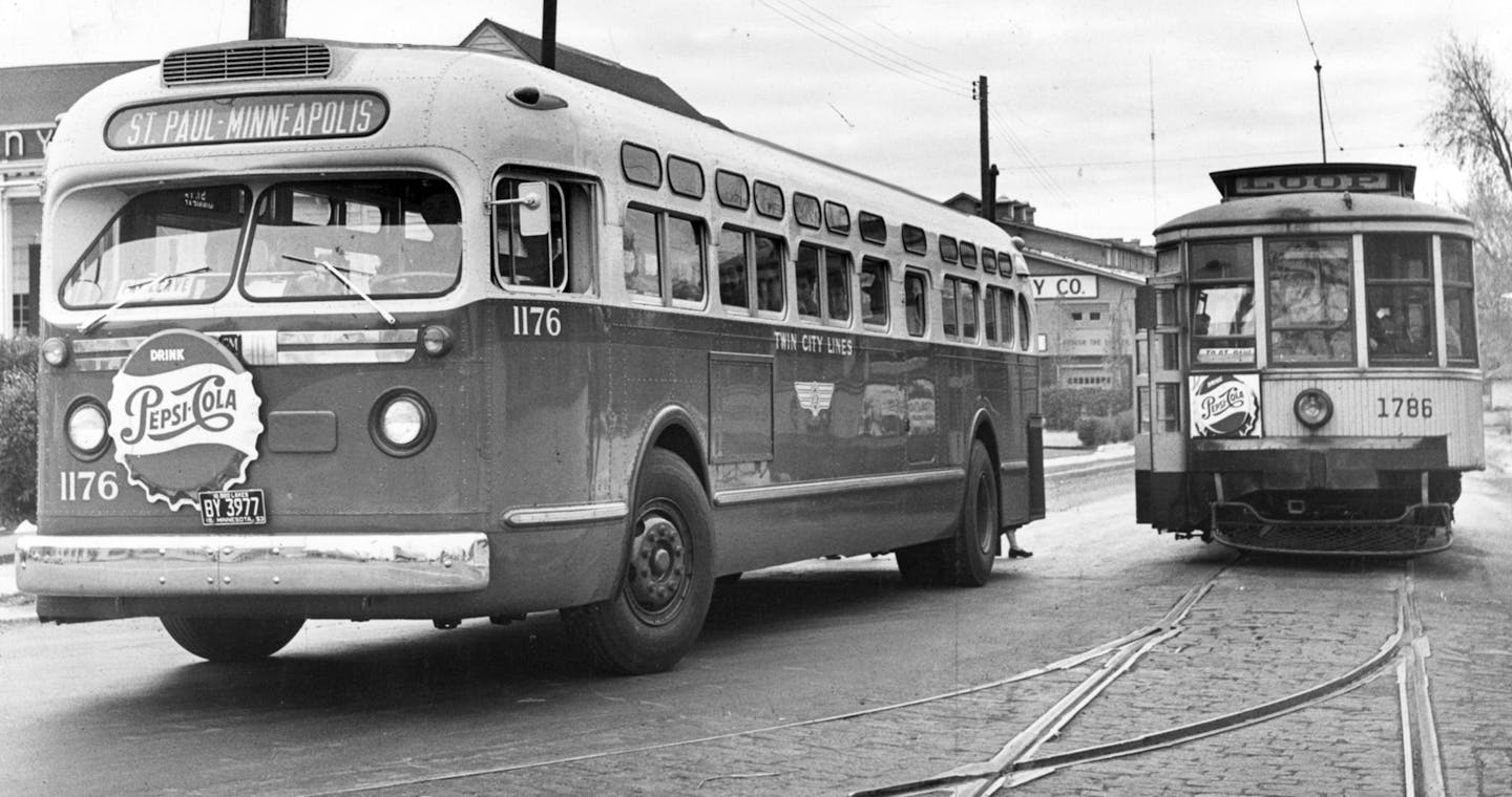 Bus & Streetcar in 1953 -- Twin City Rapid Transit Company -- Buses and streetcars shared the streets for many years in Minneapolis-St. Paul. Streetcar service ended in 1954. File photo. ORG XMIT: MIN2013031521534980 ORG XMIT: MIN1407121659281502