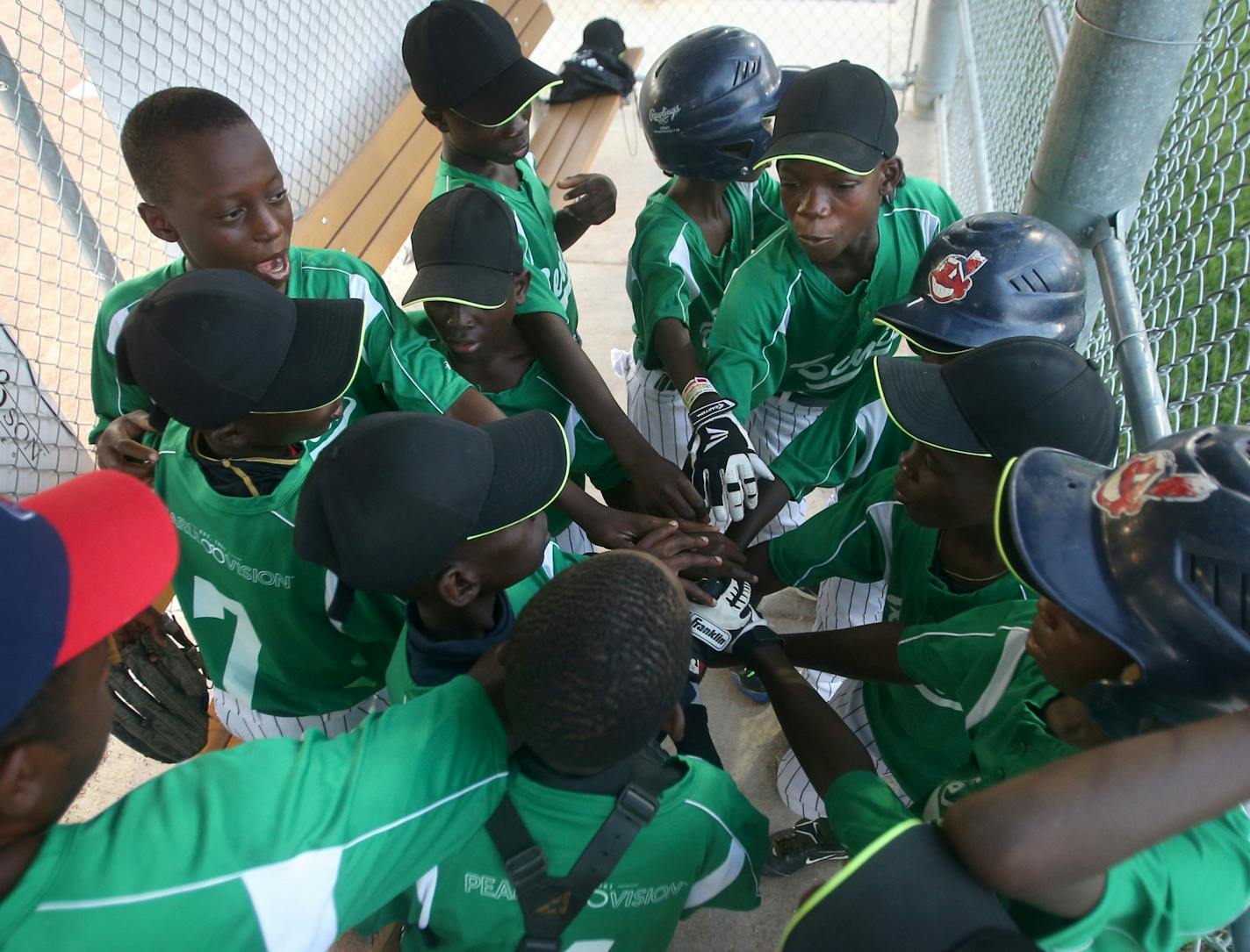 Team Benin breaks their huddle before their scrimmage against the Robbinsdale 10-year-old all-star team at Lakeview Terrace Park on Tuesday, August 2, 2016 in Robbinsdale.