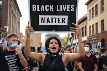 Protesters marched downtown to the Minneapolis Police Department's First Precinct on Aug. 24.