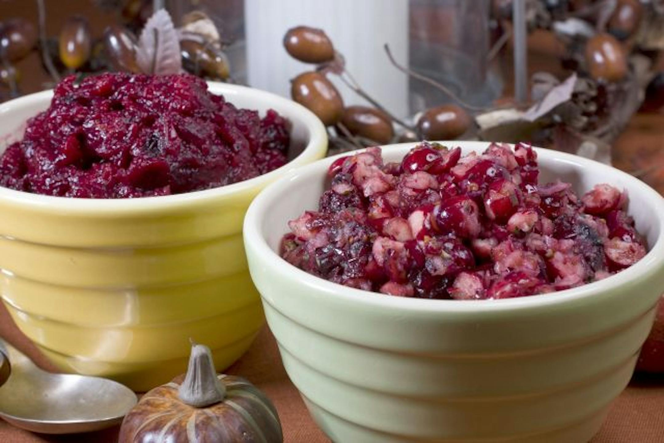 This Oct. 24, 2010 photo shows spicy cranberry salsa, right, and sauce. Cranberry salsa is perfect with tortilla chips before the big Thanksgiving meal, while cranberry sauce is a staple with the main course.