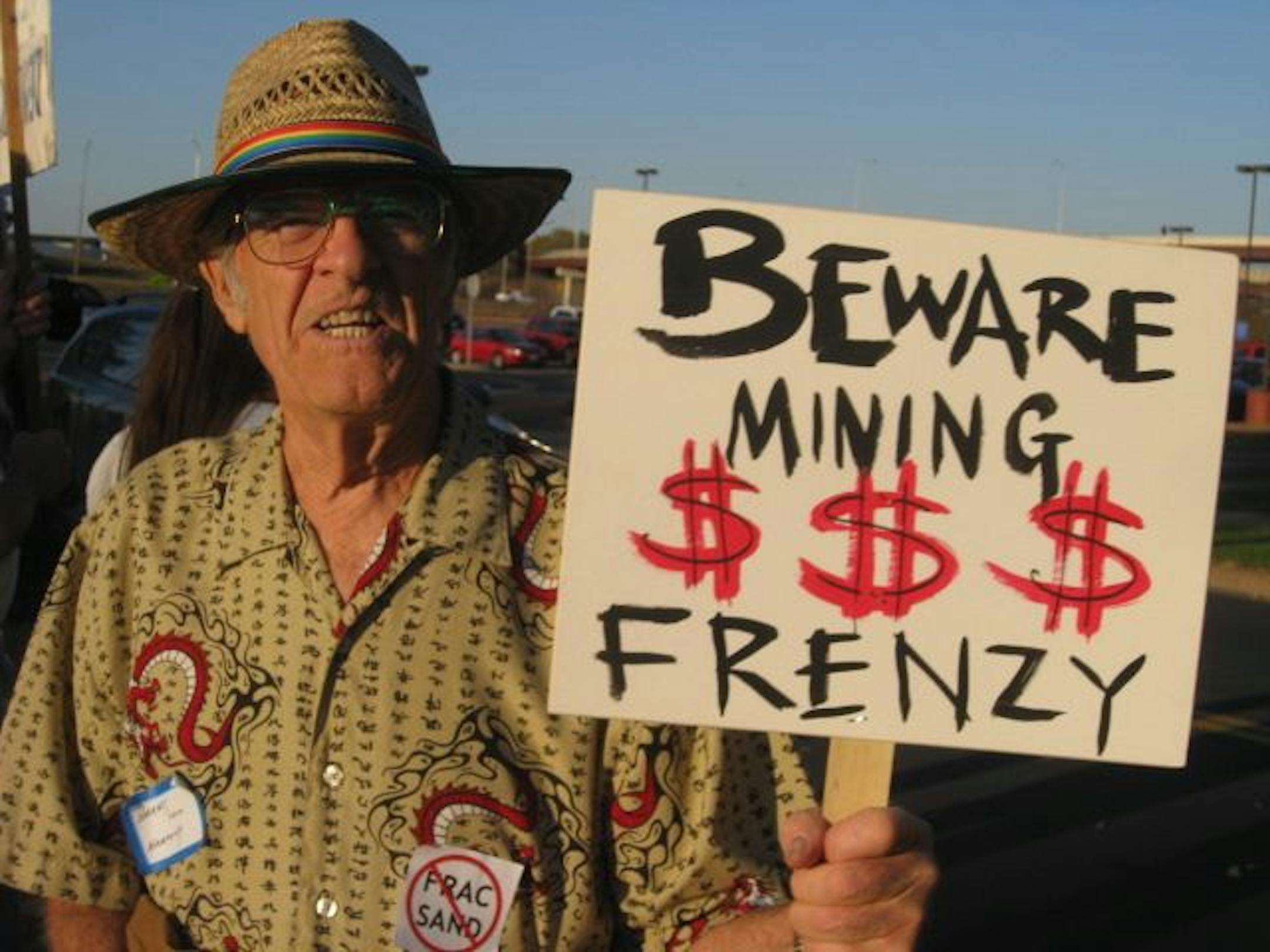 Harvey Benson, 81, came up from his home in Harmony, Minn., near the Iowa border to join protesters.