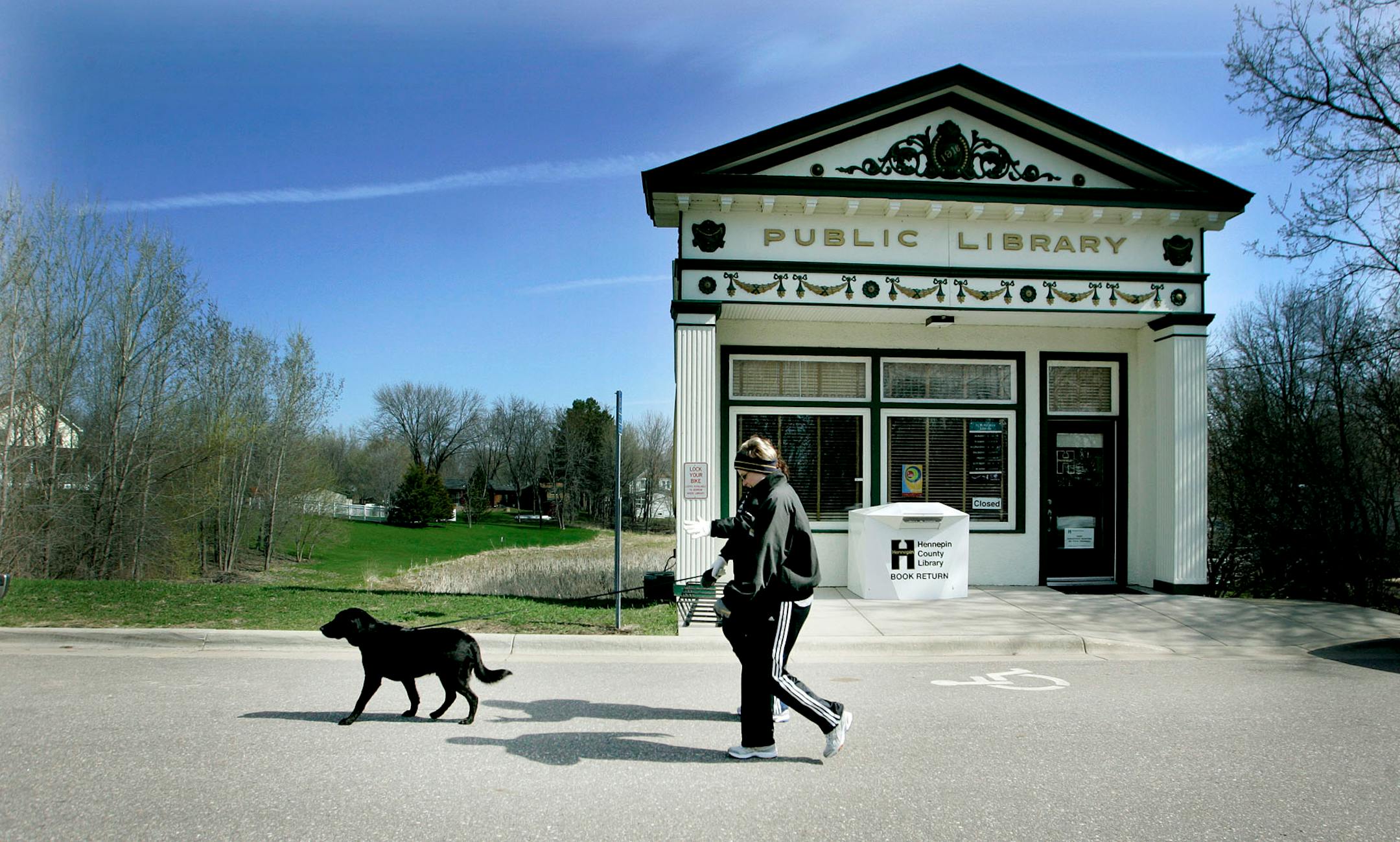 Ann Tasson, front, and Amy Mernick, both of whom lived in St. Bonifacius for 12 years before moving to Minnetrista, went for a walk through St. Bonifacius this week. Officials of the small city in far southwest Hennepin County think their taxes would be lower if the city switched to nearby Carver County.