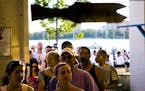 A line of about three dozen people wait to order food at The Tin Fish on Tuesday evening. Minneapolis Park Board is looking for ways to raise more mon
