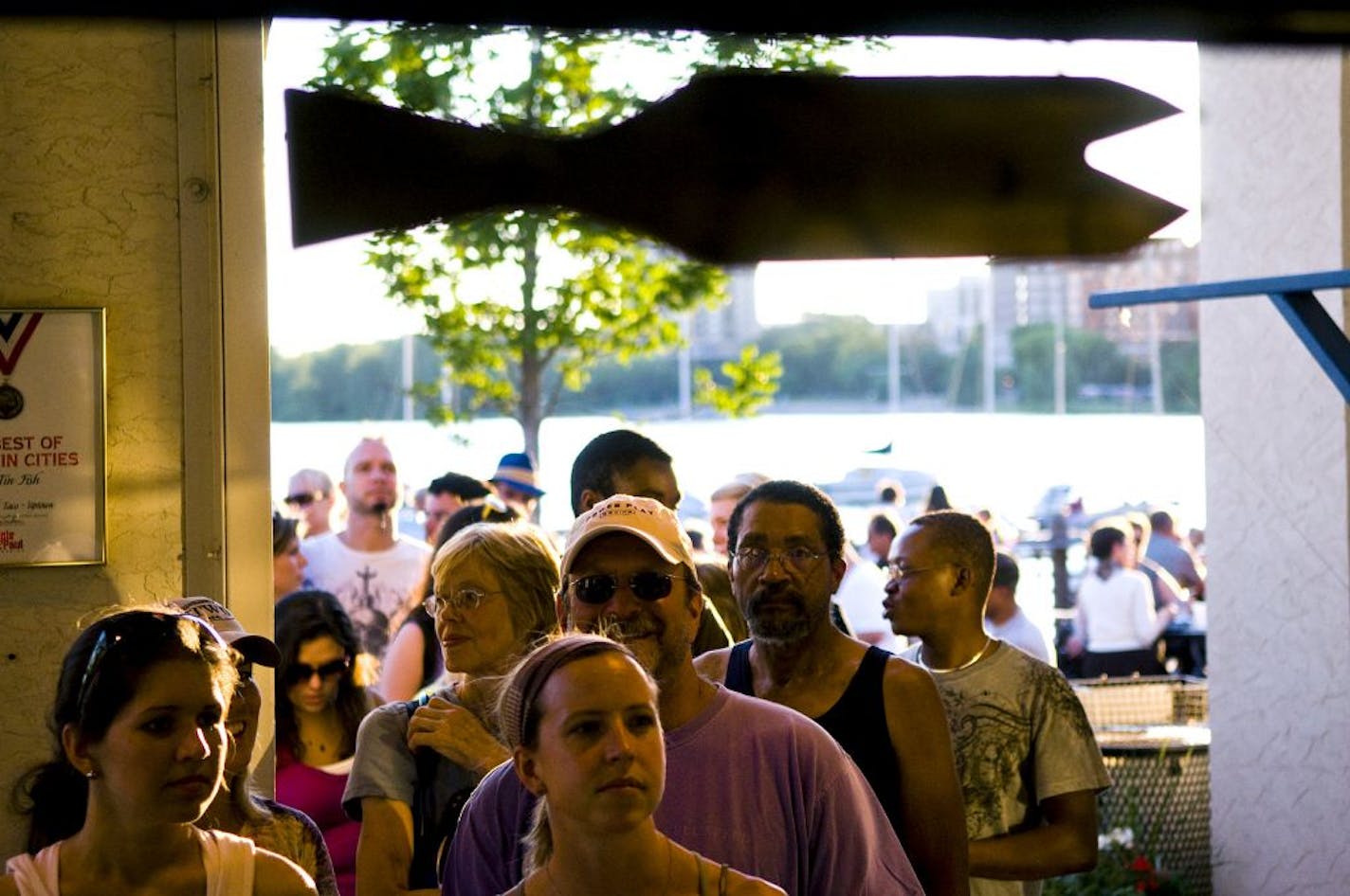 A line of about three dozen people wait to order food at The Tin Fish on Tuesday evening. Minneapolis Park Board is looking for ways to raise more money and one option is to open more concession stands such as The Tin Fish.