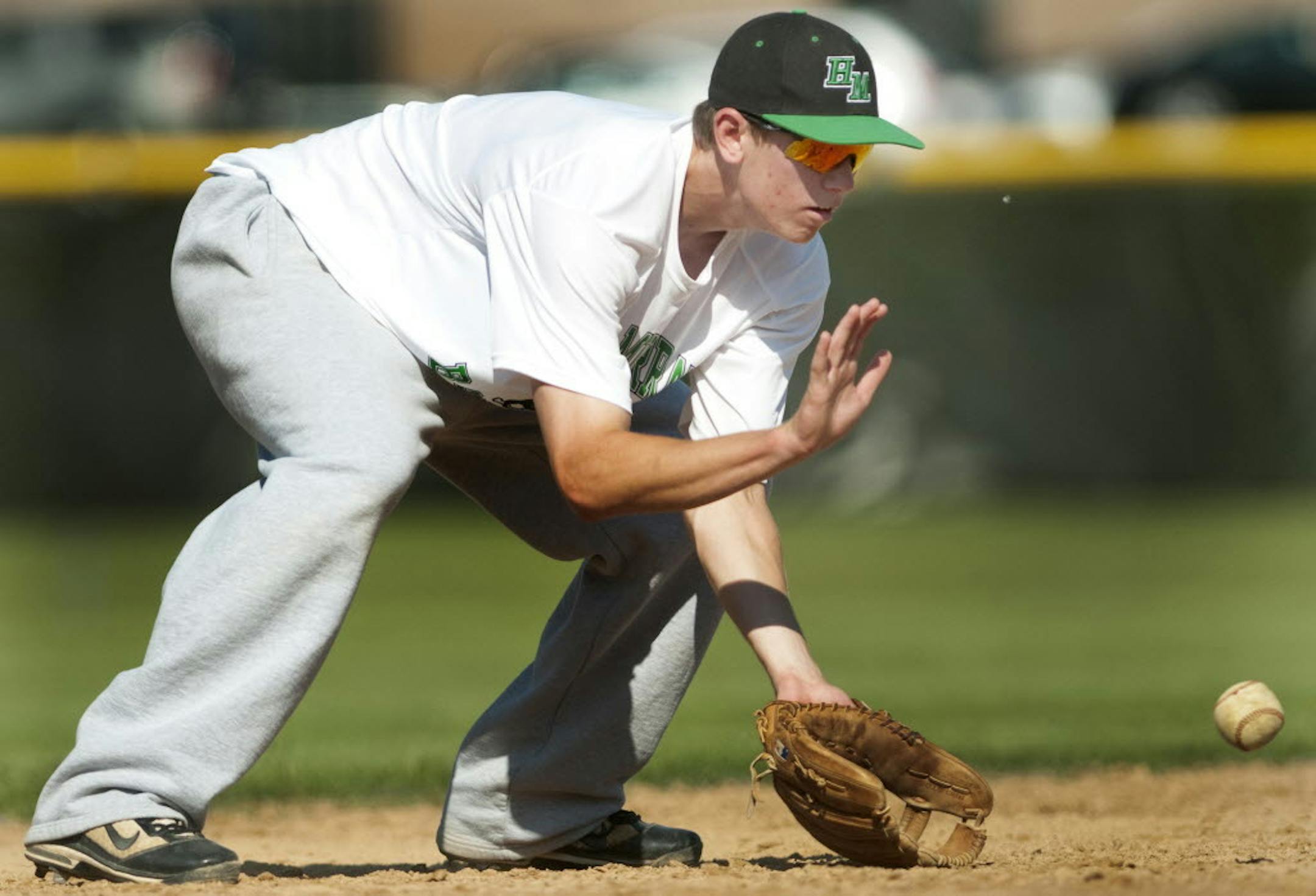 Hill-Murray shortstop Cory Quinlan fielded baseballs during a Pioneers practice. Hitting hasn't been a problem for Quinlan, who has been batting more than .500 this season, and he has worked to elevate his defensive game as well. He has played a key role in the Pioneers' 13-1 season. Photo by MARISA WOJCIK, mwojcik@startribune.com