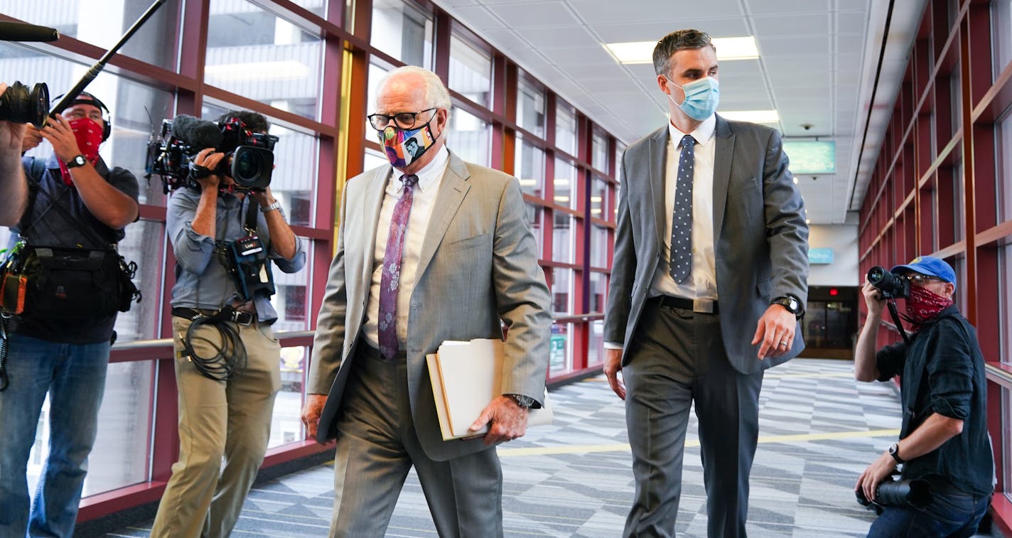 Former Minneapolis police officer Thomas Lane, right, entered the Hennepin County Public Safety Facility Monday morning with his attorney Earl Gray, left. ] GLEN STUBBE • glen.stubbe@startribune.com Monday, June 29, 2020 All four former officers charged in the killing of George Floyd will appear in court one-at-a-time Monday starting at 12:15 p.m. Derek Chauvin will appear remotely via remote TV. Two of his former colleagues, J. Alexander Kueng and Thomas Lane, have posted bond should have to us