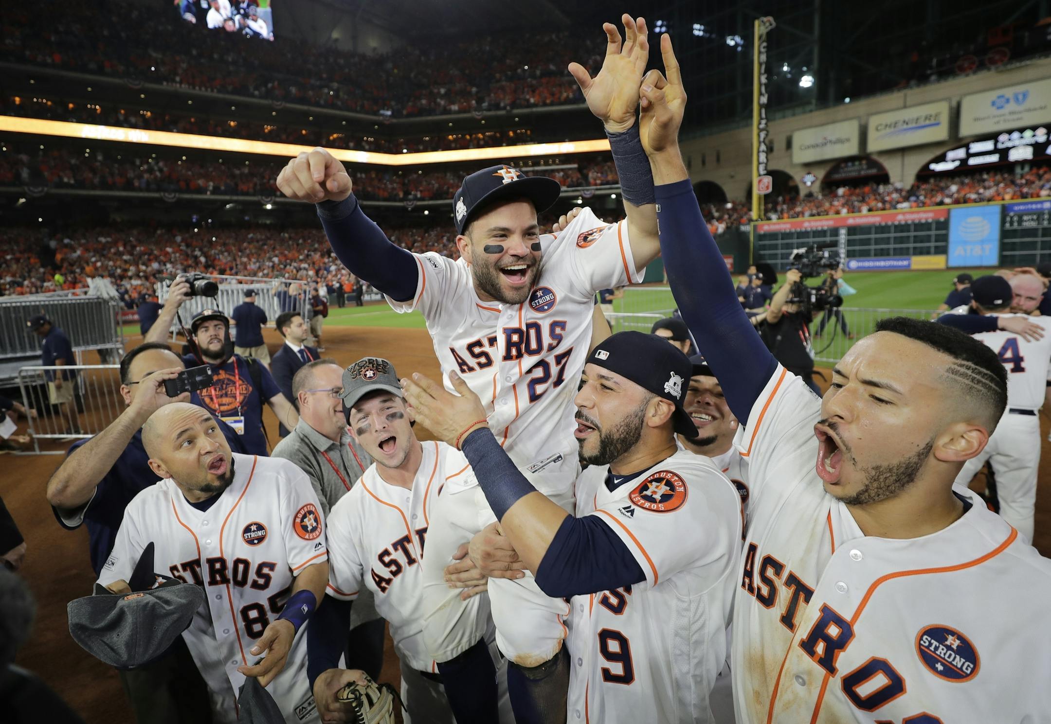 Houston Astros' Jose Altuve is lifted by teammates after Game 7 of baseball's American League Championship Series against the New York Yankees Saturday, Oct. 21, 2017, in Houston. The Astros won 4-0 to win the series. (AP Photo/David J. Phillip)