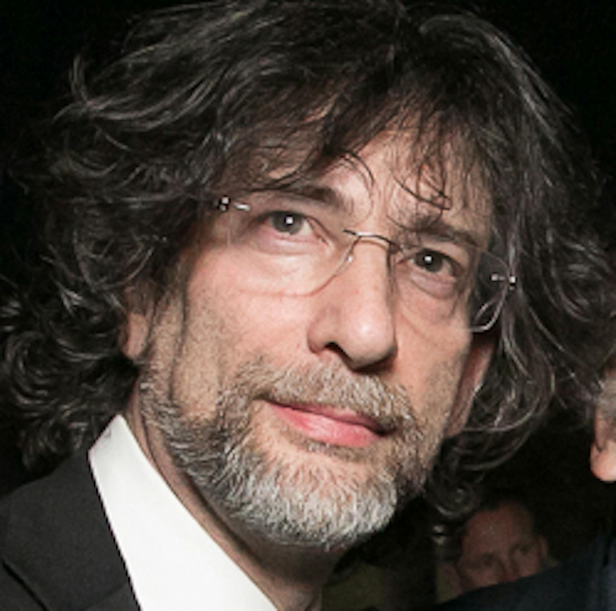 In this May 5, 2015 photo released by the PEN American Center, British author Neil Gaiman, from left, and American cartoonist Art Spiegelman, pose with Charlie Hebdo's critic-essayist Jean-Baptiste Thoret, and Editor-in-Chief Gerard Biard, during the 2015 PEN Gala at the American Museum of Natural History in New York. Charlie Hebdo recieved the Freedom of Expression Courage Award. (Beowulf Sheehan/PEN American Center via AP)
