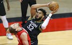 Timberwolves center Karl-Anthony Towns is blocked by Rockets forward Kelly Olynyk during the first quarter