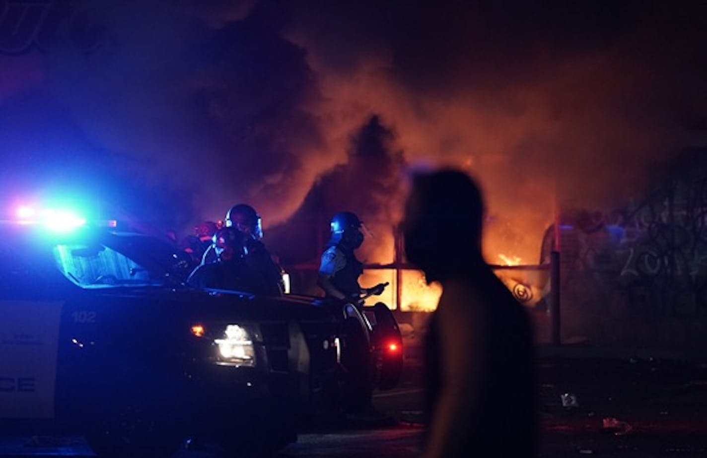 Authorities responded to a fire in an auto parts store across from the Minneapolis police's Third Precinct station on Wednesday.