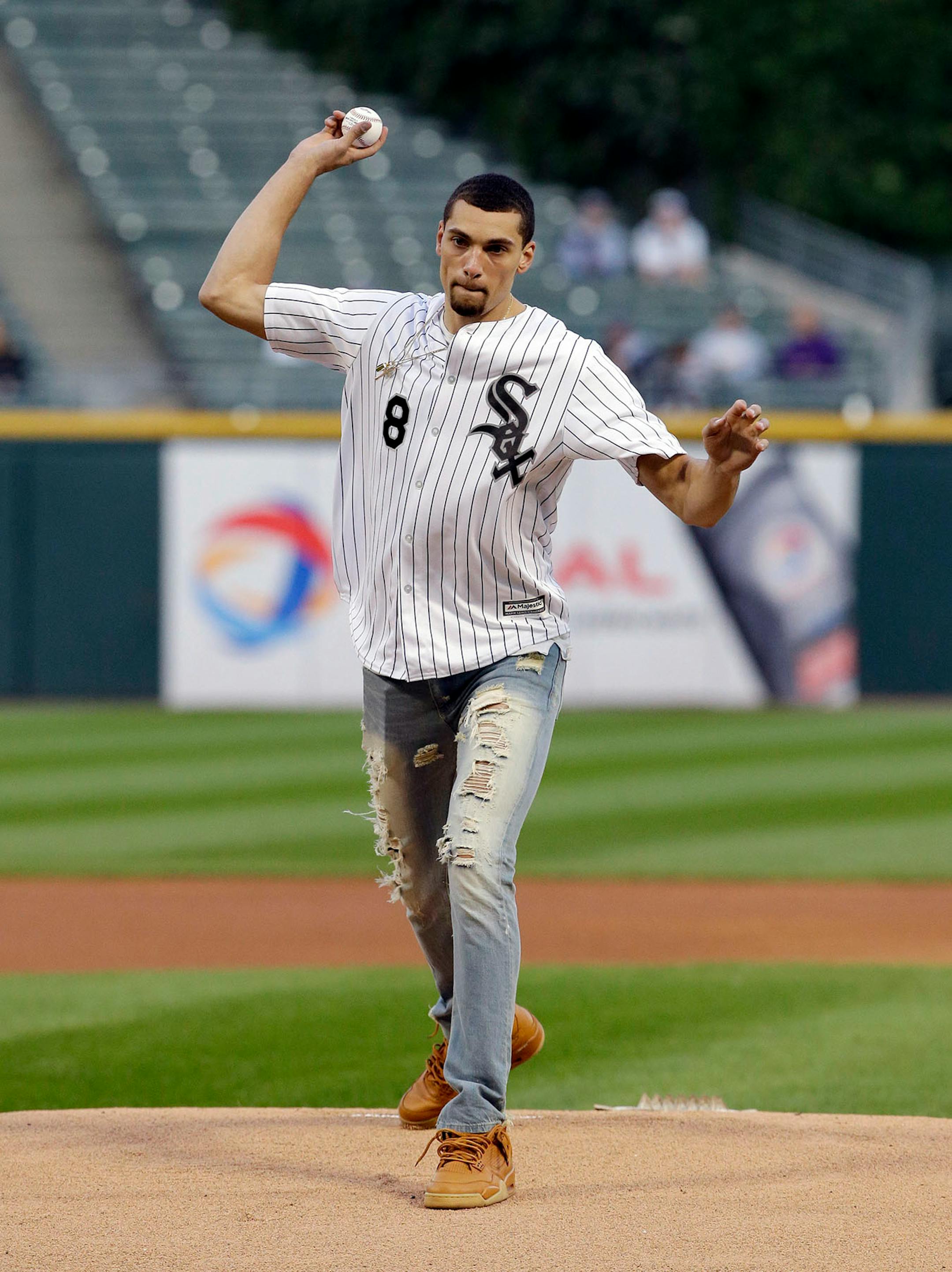 Chicago Bulls' Zach Lavine throws out a ceremonial first pitch before a baseball game between the Minnesota Twins and the Chicago White Sox, Thursday, Aug. 24, 2017, in Chicago.