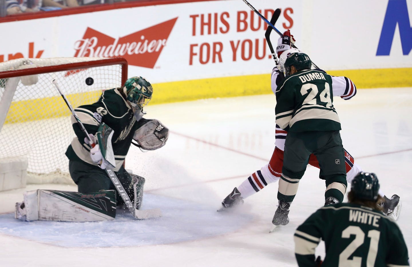 The Jets' Andrew Copp, right rear, scored on Wild goaltender Devan Dubnyk as defenseman Matt Dumba defended during the first period of Winnipeg's 5-4 victory Sunday.