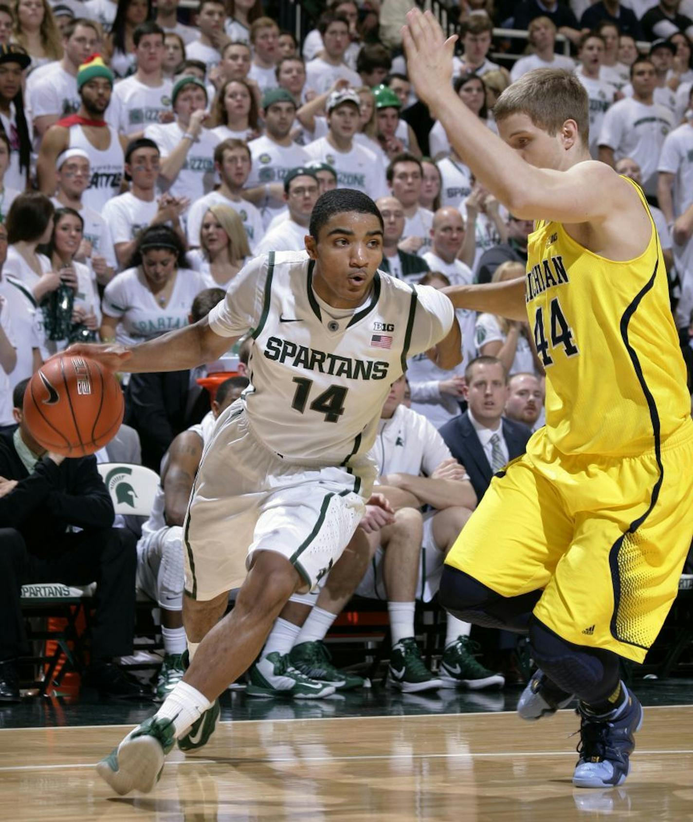 Michigan State's Gary Harris drives against Michigan's Bella Sibedwo.