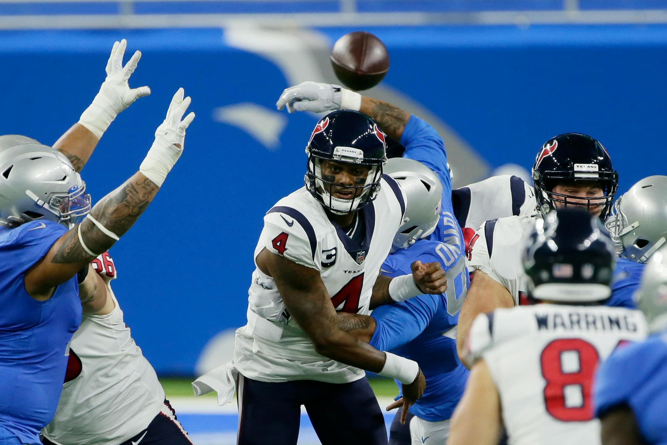 Texans quarterback Deshaun Watson throws under pressure during the first half