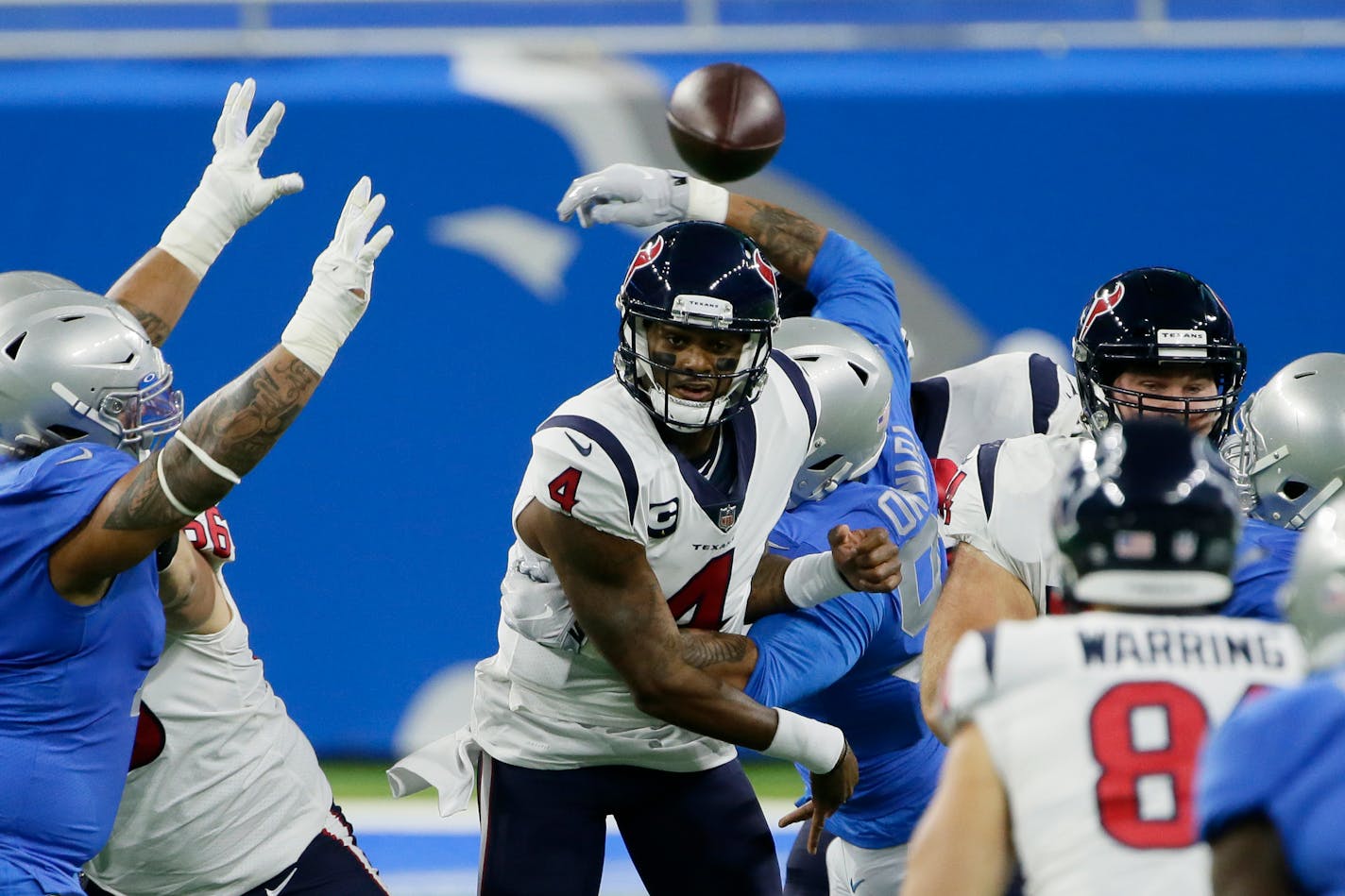 Texans quarterback Deshaun Watson throws under pressure during the first half