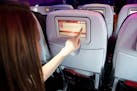 This product image provided by Virgin America Airlines shows a demonstration of the airline's in-flight on demand food and drink ordering system. Thro