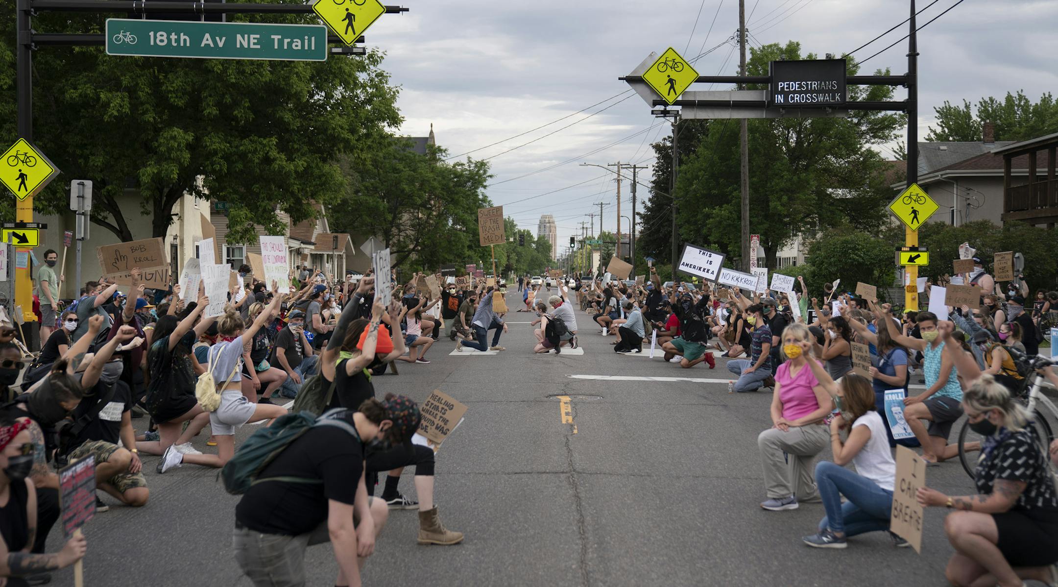 Protesters kneel in the street for a moment of silence while protesting at the Minneapolis Police and Fire Union Offices, demanding the resignation police union president Lt. Bob Kroll in Minneapolis on Wednesday, June 3, 2020. (Renee Jones Schneider/Minneapolis Star Tribune/TNS) ORG XMIT: 1680097