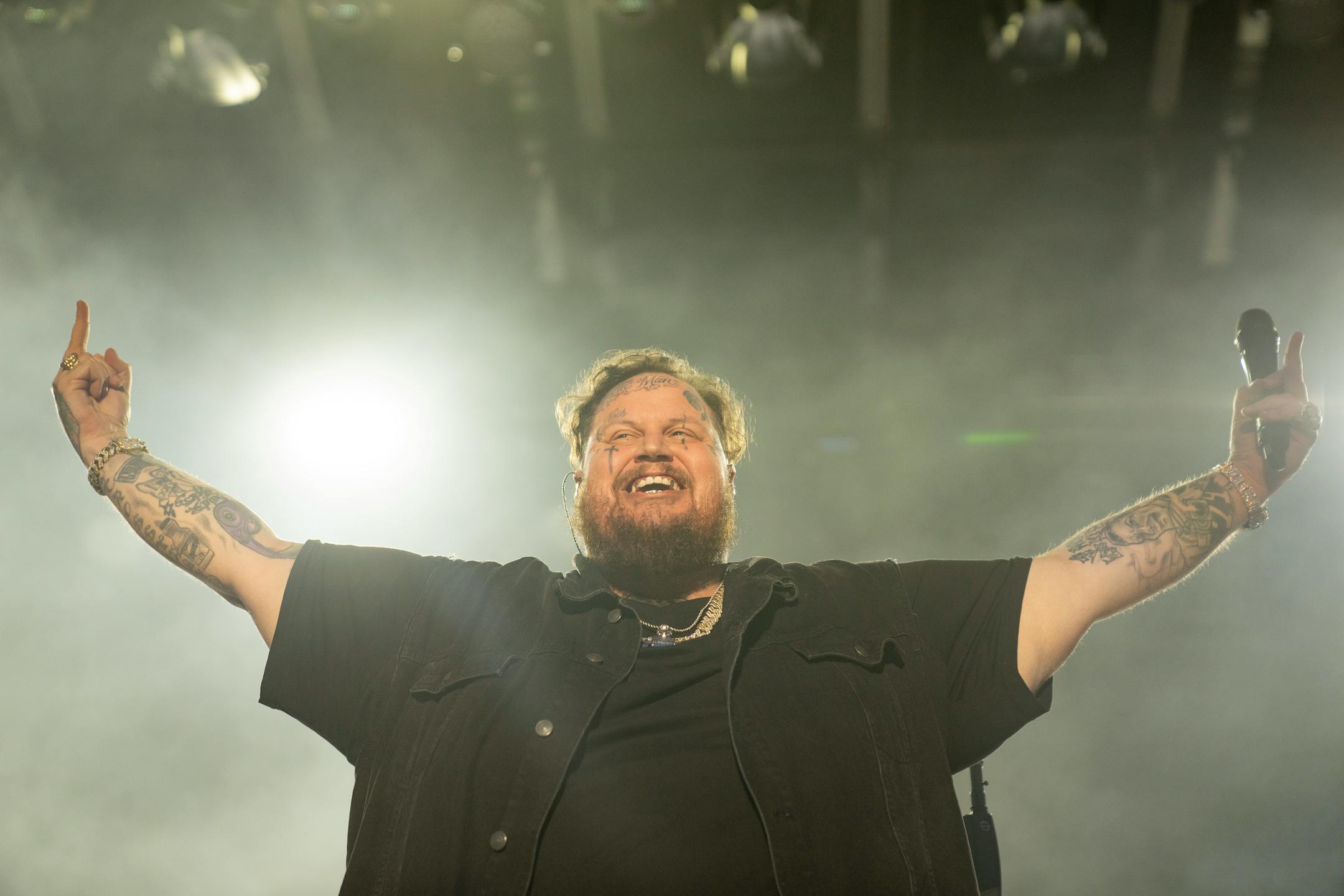 Jelly Roll, a rising country music star, flips off the crowd as he performs Friday, July 07, 2023, at Mystic Lake Casino amphitheater in Prior Lake, Minn.