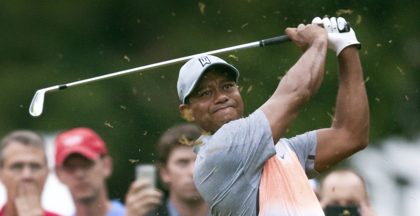 Tiger Woods tees off on the third hole during the pro-am at the Wyndham Championship golf tournament, Wednesday, Aug. 19, 2015, at Sedgefield Country Club in Greensboro, N.C. (AP Photo/Rob Brown)