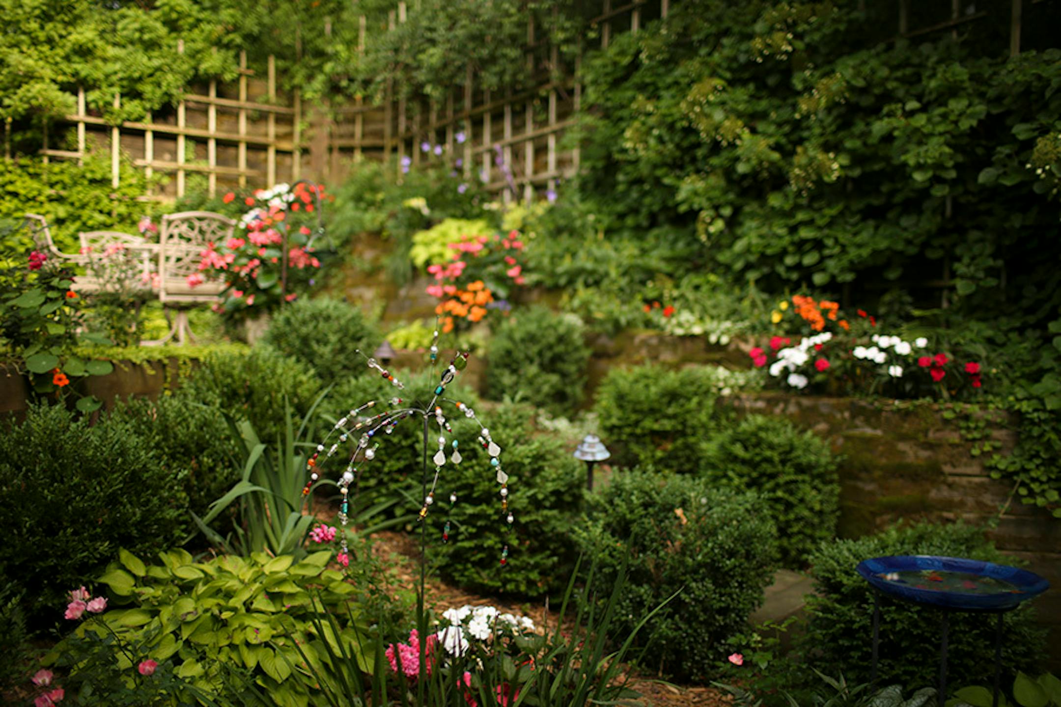 The terraced garden has a patio at the top.