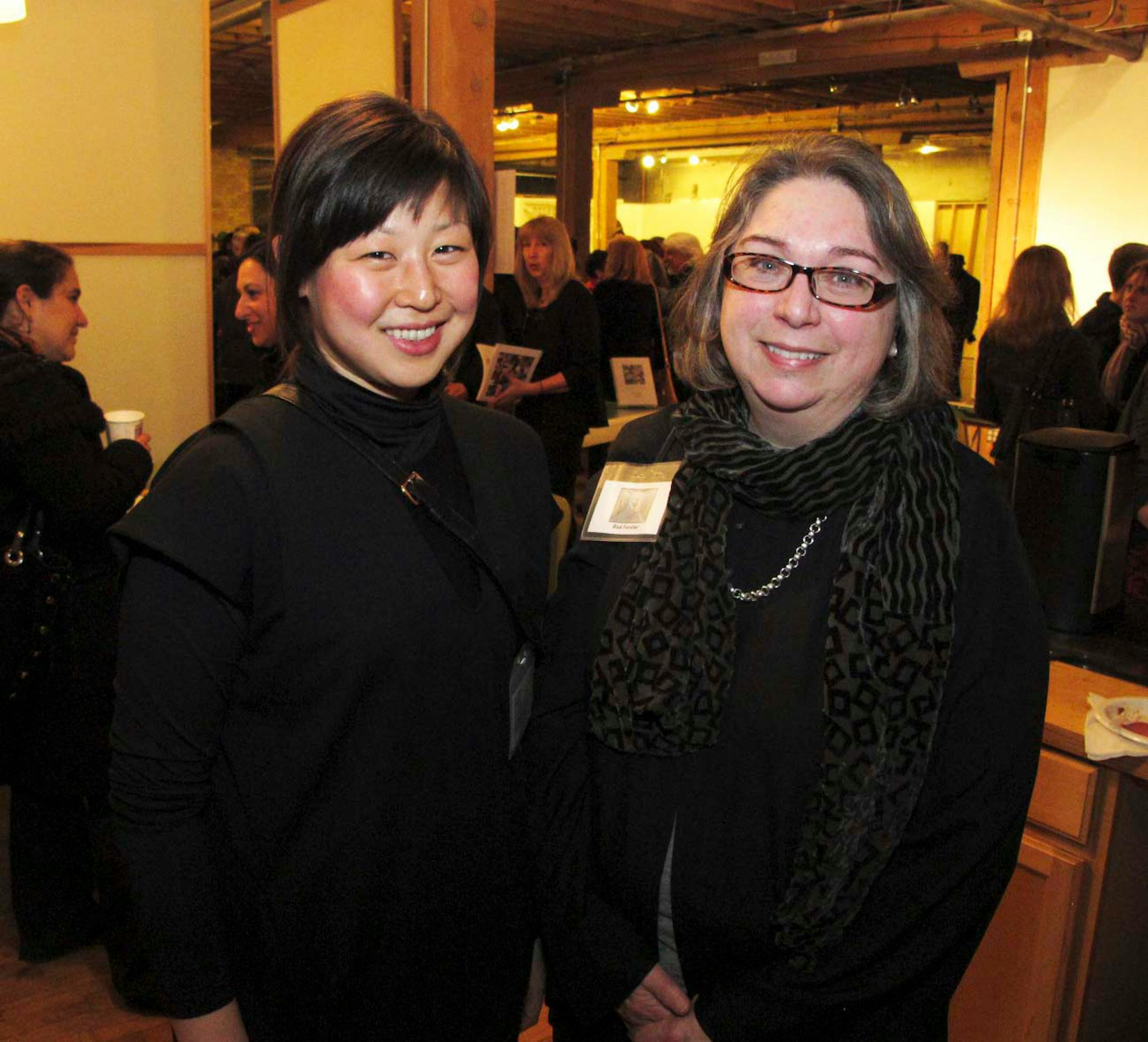 Christina Chang, assistant curator of the Weisman Art Museum and curator for the "Woman as Photographer" exhibit and Rise Ferster, photographer and first place winner of the exhibit.