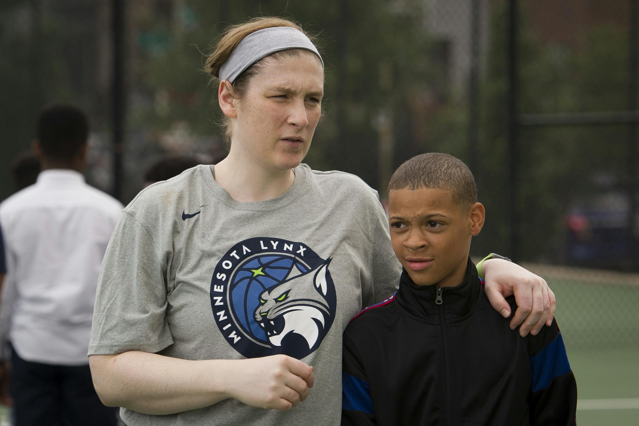 WNBA Champion Minnesota Lynx guard Lindsay Whalen walks with fifth grade student Ethan Shepard at Payne Elementary School in Washington, Wednesday, June 6, 2018. Payne Elementary has the highest homeless student population in Washington.