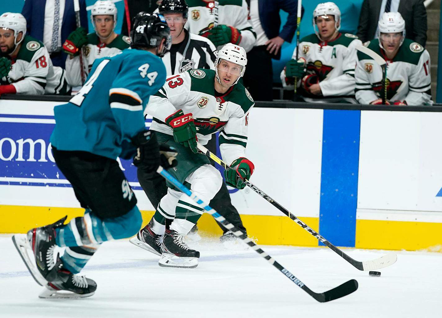 Minnesota Wild center Nick Bonino (13) skates down the ice against San Jose Sharks defenseman Marc-Edouard Vlasic (44) during the second period of an NHL hockey game in San Jose, Calif., Monday, Feb. 22, 2021. (AP Photo/Tony Avelar)