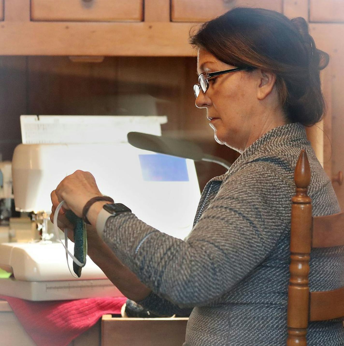 Julie Skovran, who lives in Lakeville, has enlisted a few friends and has been sewing masks for health care workers. Like other sewers across the state, they know the fabric masks are no substitute for the N95 and other medical-grade masks but have been told it's better than a bandana or nothing at all. Skovran was seen making masks from home Friday, April 3, 2020, in Lakeville, MN.