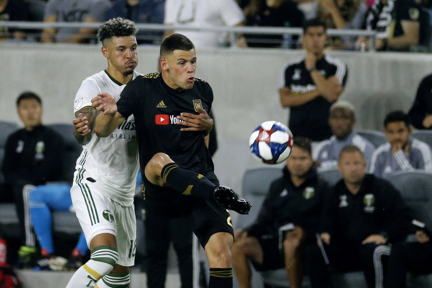 Forward Christian Ramirez, right, traded from Minnesota United to Los Angeles FC last season, was traded again last month to Houston, which plays host to the Loons on Wednesday. He is shown here in an LAFC match against Portland in July.