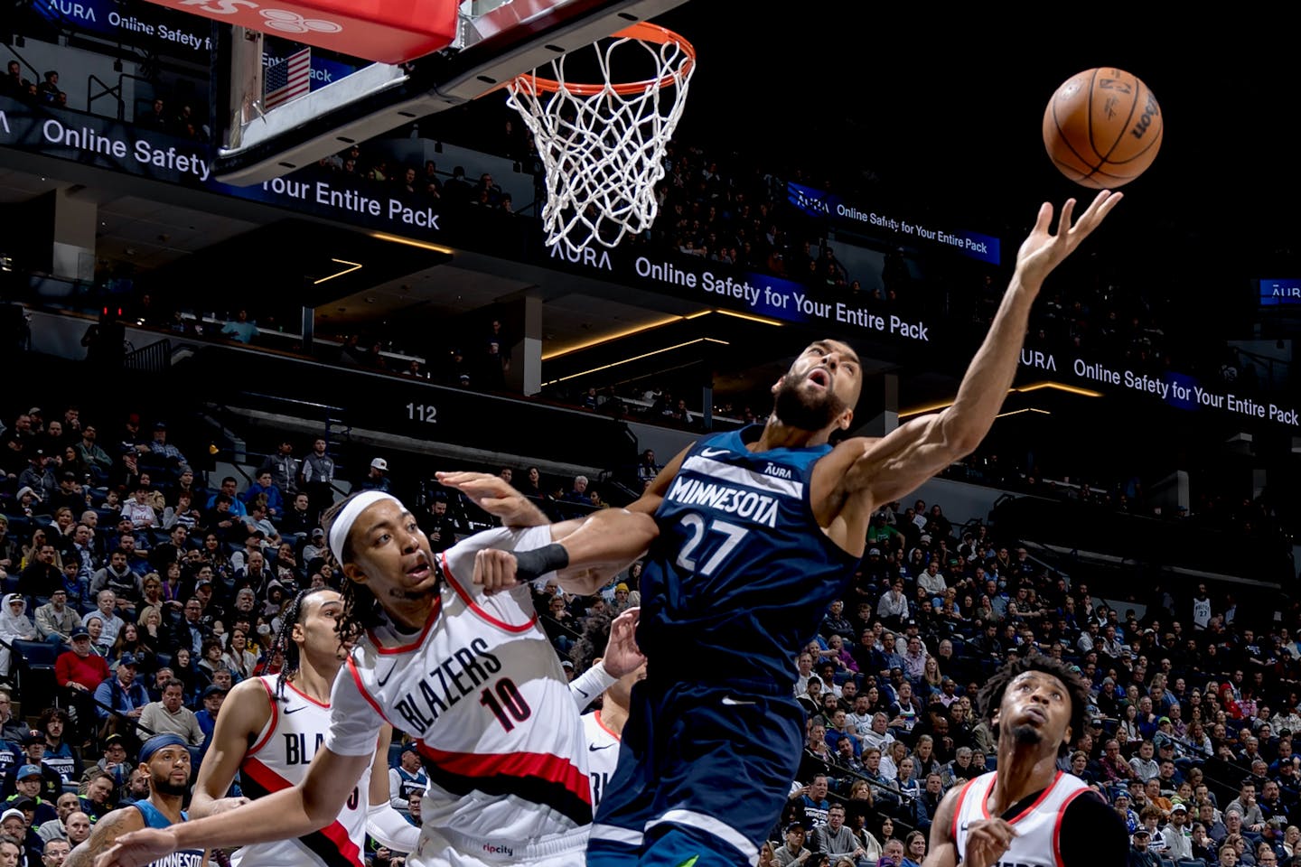 Rudy Gobert of the Timberwolves fights with Moses Brown of the Trail Blazers for a rebound in the second quarter.