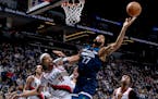 Rudy Gobert of the Timberwolves fights with Moses Brown of the Trail Blazers for a rebound in the second quarter.