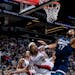 Timberwolves center Rudy Gobert extended for a rebound over Portland forward Moses Brown in the second quarter.