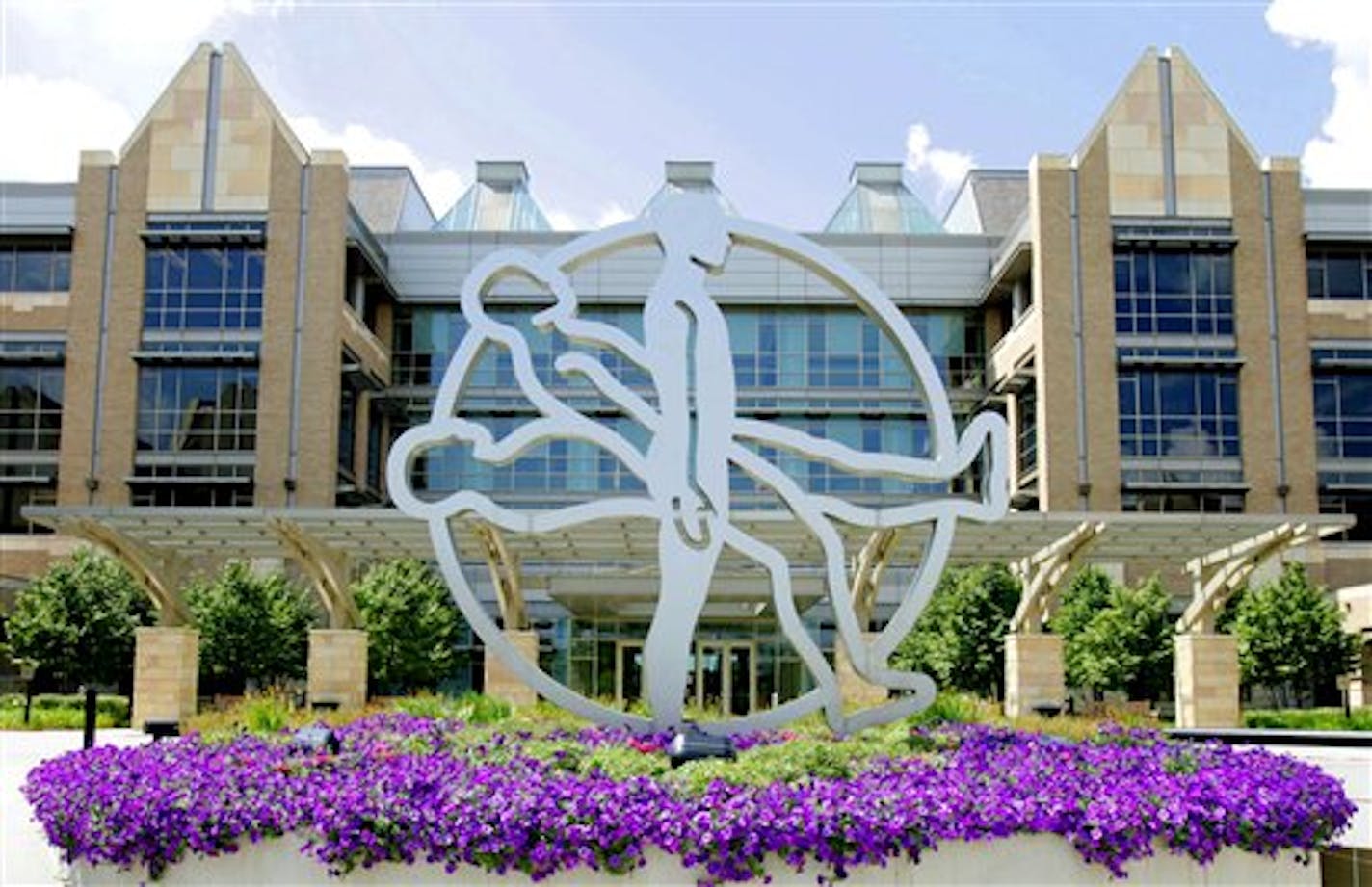 FILE - In this Aug. 16, 2005, the "Rising Man" symbol stands in front of the Fridley, Minn., based Medtronic. Medtronic said Wednesday, Nov. 18, 2009, it is responding to a warning letter from the Food and Drug Administration about procedures at the Minnesota headquarters of its heart implants division.(AP Photo/Jim Mone, File)