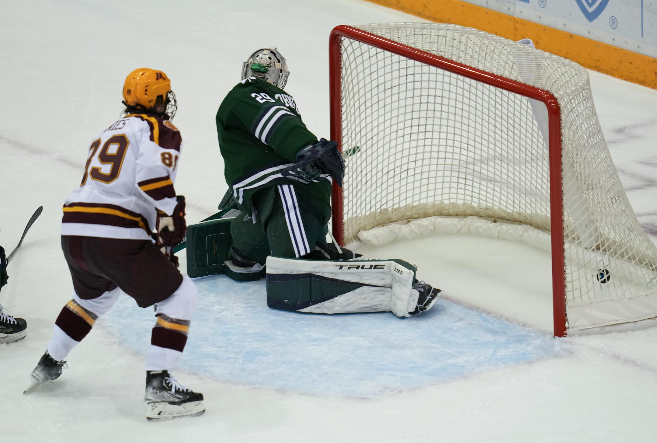 Minnesota forward Mason Nevers' (18) shot got past Mercyhurst goaltender Hank Johnson (29) for a Minnesota point in the first period.