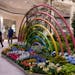 Mall walkers Debbie and Tom Welch, of Edina, walk past a planter installation. "This is incredible," said Debbie. "I can't imagine putting it all toge