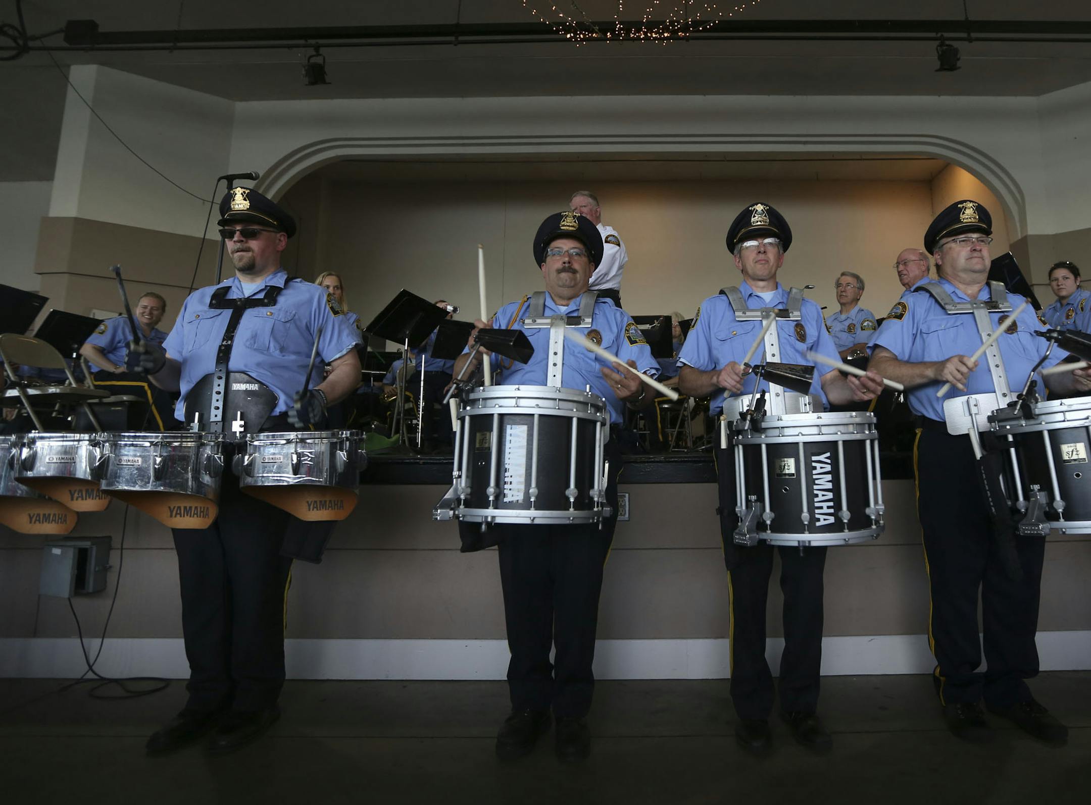 St Paul Police Band drumline played in the front of the stage during the St. Paul Police Band concert at the Como Park Pavilion in St. Paul Min., Tuesday, August 6, 2013. ] (KYNDELL HARKNESS/STAR TRIBUNE) kyndell.harkness@startribune.com