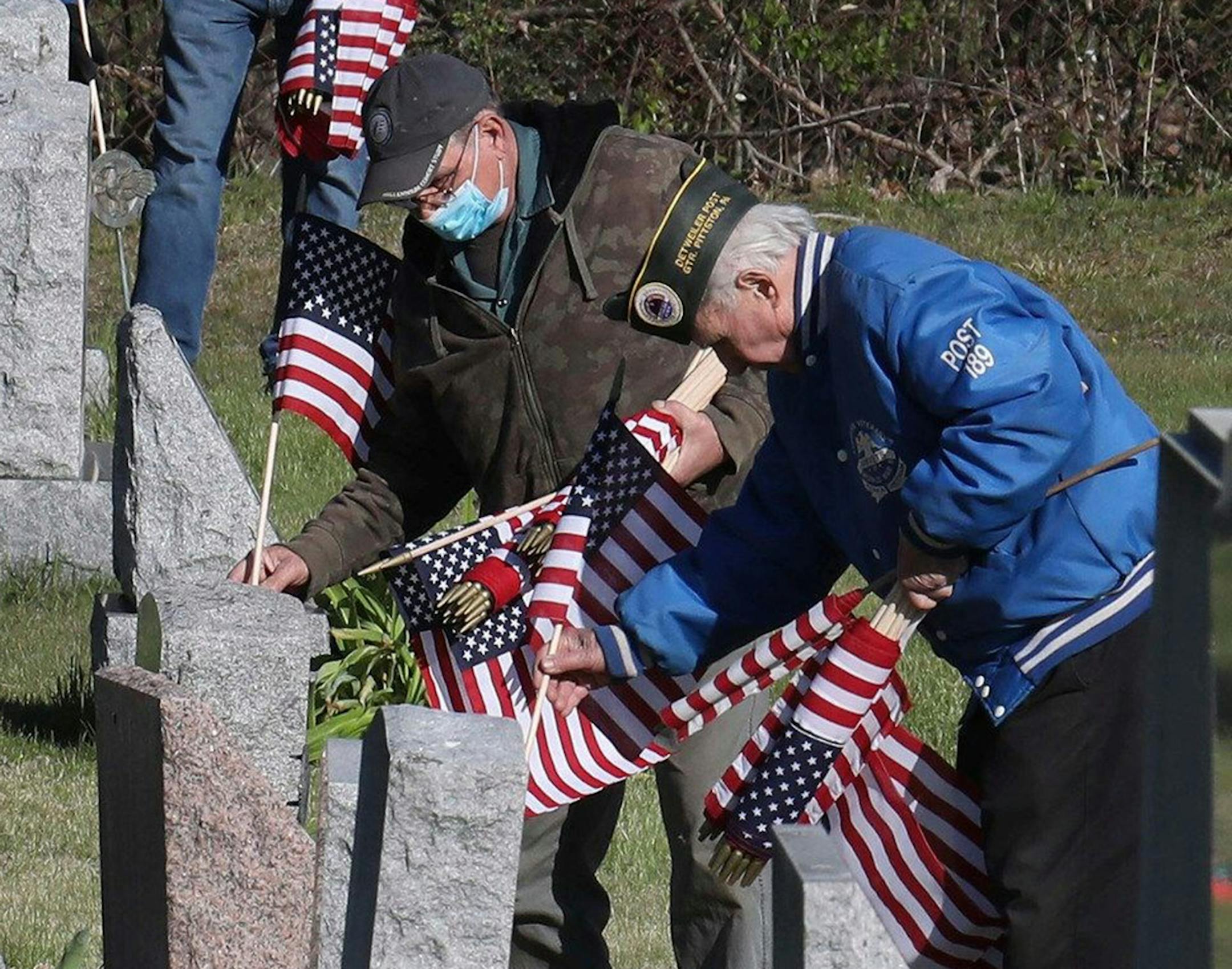 Veterans Gene Szumski and Thomas Skrzysowski helped prepare for Memorial Day in Dupont, Pa.