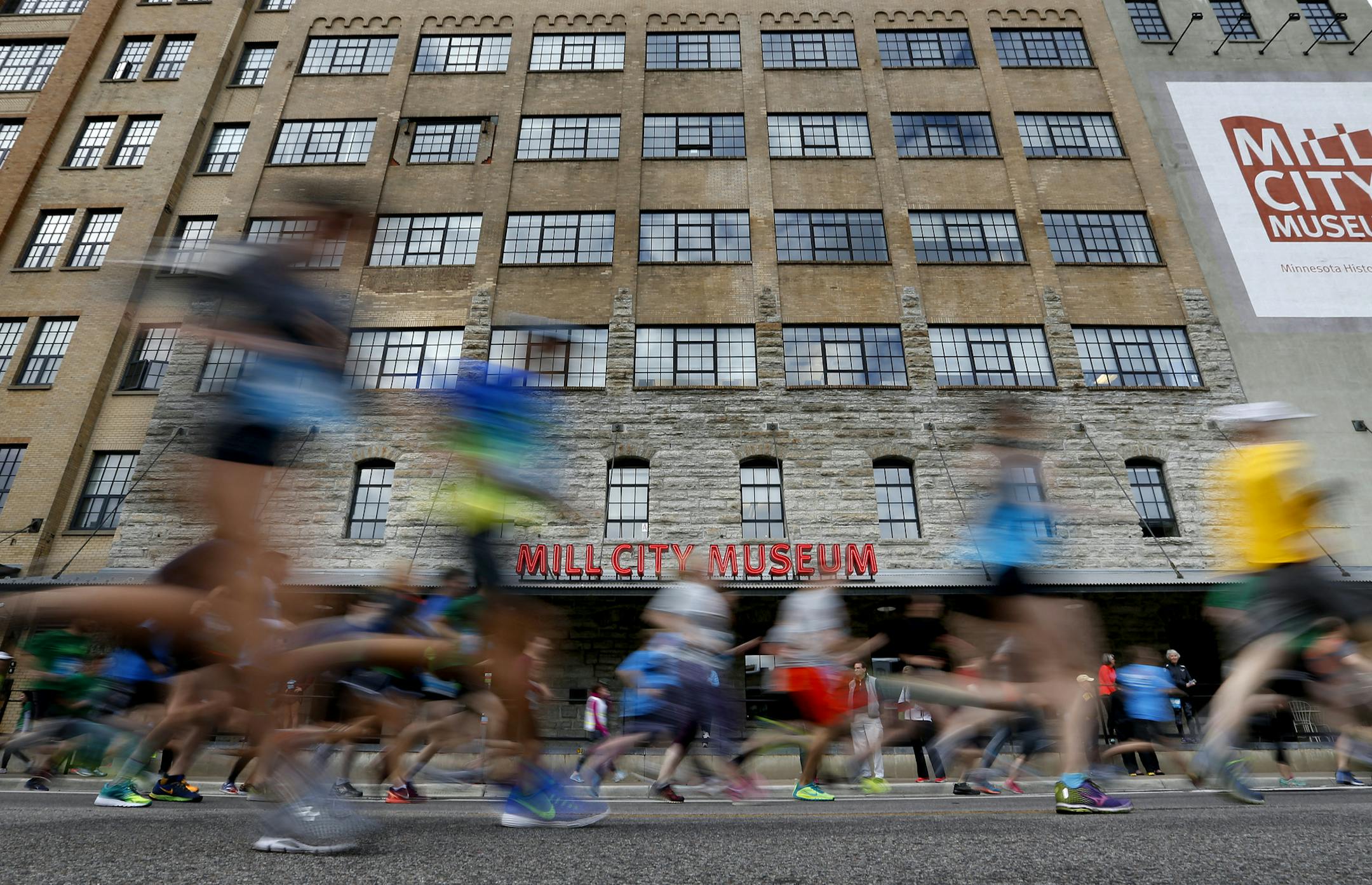Runners made their way down South Second Street past the Mill City Museum during the TC 1 Mile on Thursday in Minneapolis.