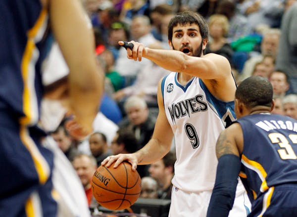 Minnesota Timberwolves guard Ricky Rubio directs traffic against the Indiana Pacers during their NBA basketball game Wednesday, Feb. 19, 2014 in Minne