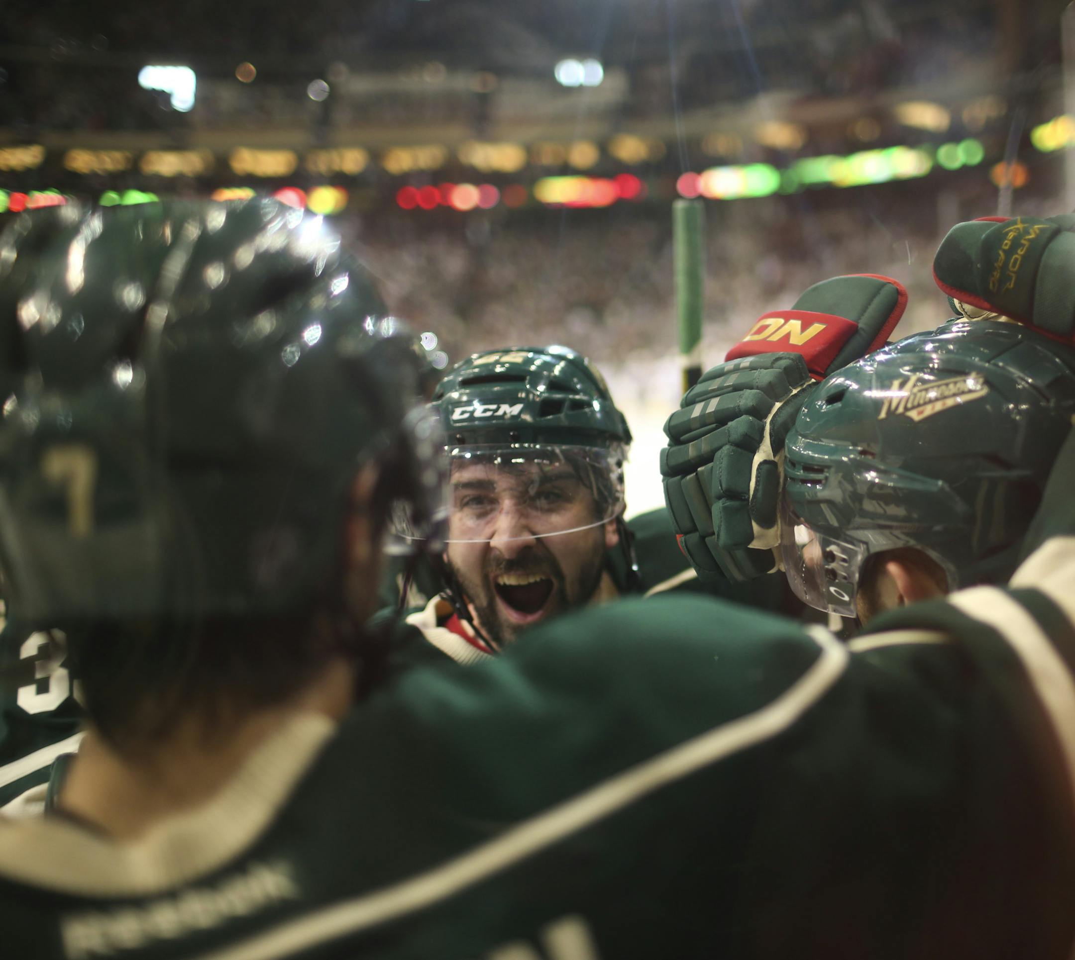 The Minnesota Wild beat the Chicago Black Hawks 3-2 in overtime in game three of their first round playoff series Sunday afternoon, May 25, 2013 at Xcel Energy Center in St. Paul. Wild teammates, including Cal Clutterbuck, facing camera, mobbed Jason Zucker, right, after his game winning goal. ] JEFF WHEELER ‚Ä¢ jeff.wheeler@startribune.com
