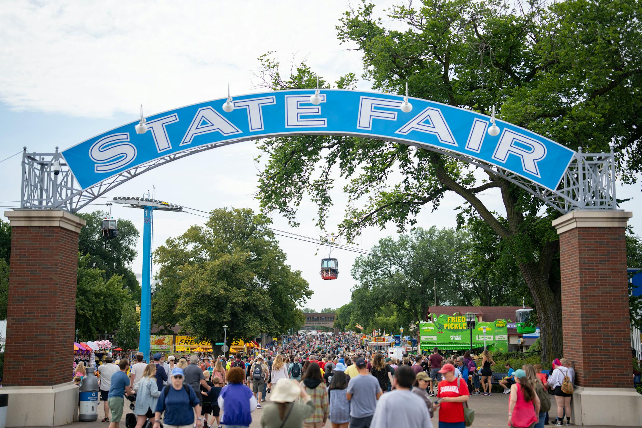 Thousands of people move through The State Fairgrounds on opening morning of the Minnesota State Fair in Falcon Heights, Minn. on Thursday, Aug. 22, 2024.  ]

ALEX KORMANN • alex.kormann@startribune.com