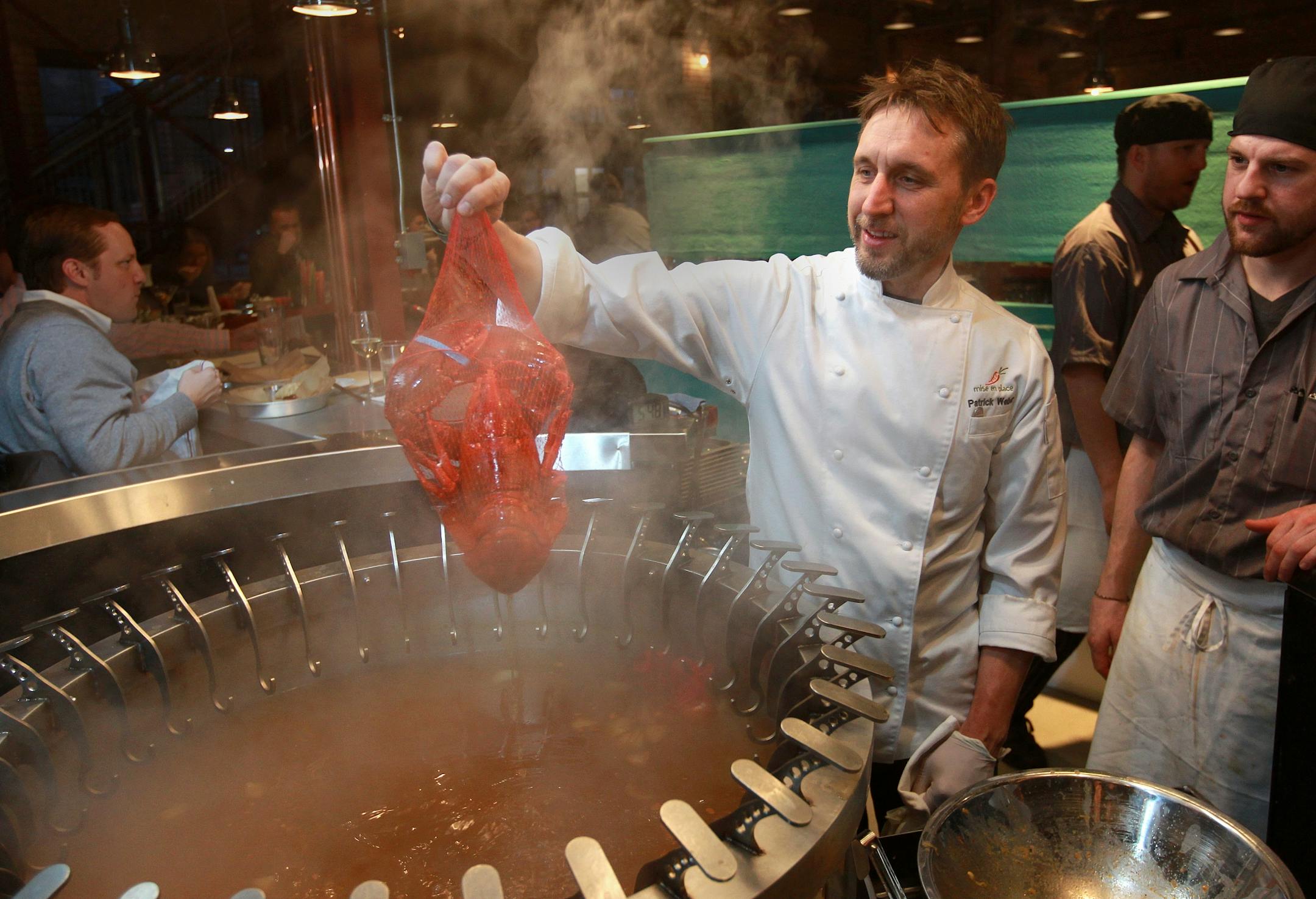 Chef Patrick Weber with a big one going in the boil at the Smack Shack. The Smack Shack and 'Borough' two of many restaurants that are luring the young foodies in with great food. [ TOM WALLACE � twallace@startribune.com _ Assignments #20027523A_ Feburary 8, 2013_ SLUG: 744466 youngfoodies _ EXTRA INFORMATION: magic saxo number is 744466 __ Young foodies spending their disposable income on good food in area restaurants.