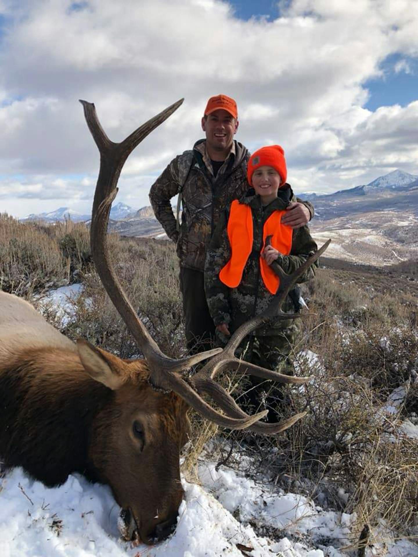 John Gegen, 12, of Hastings with his father, Jon, and the boy's bull elk.